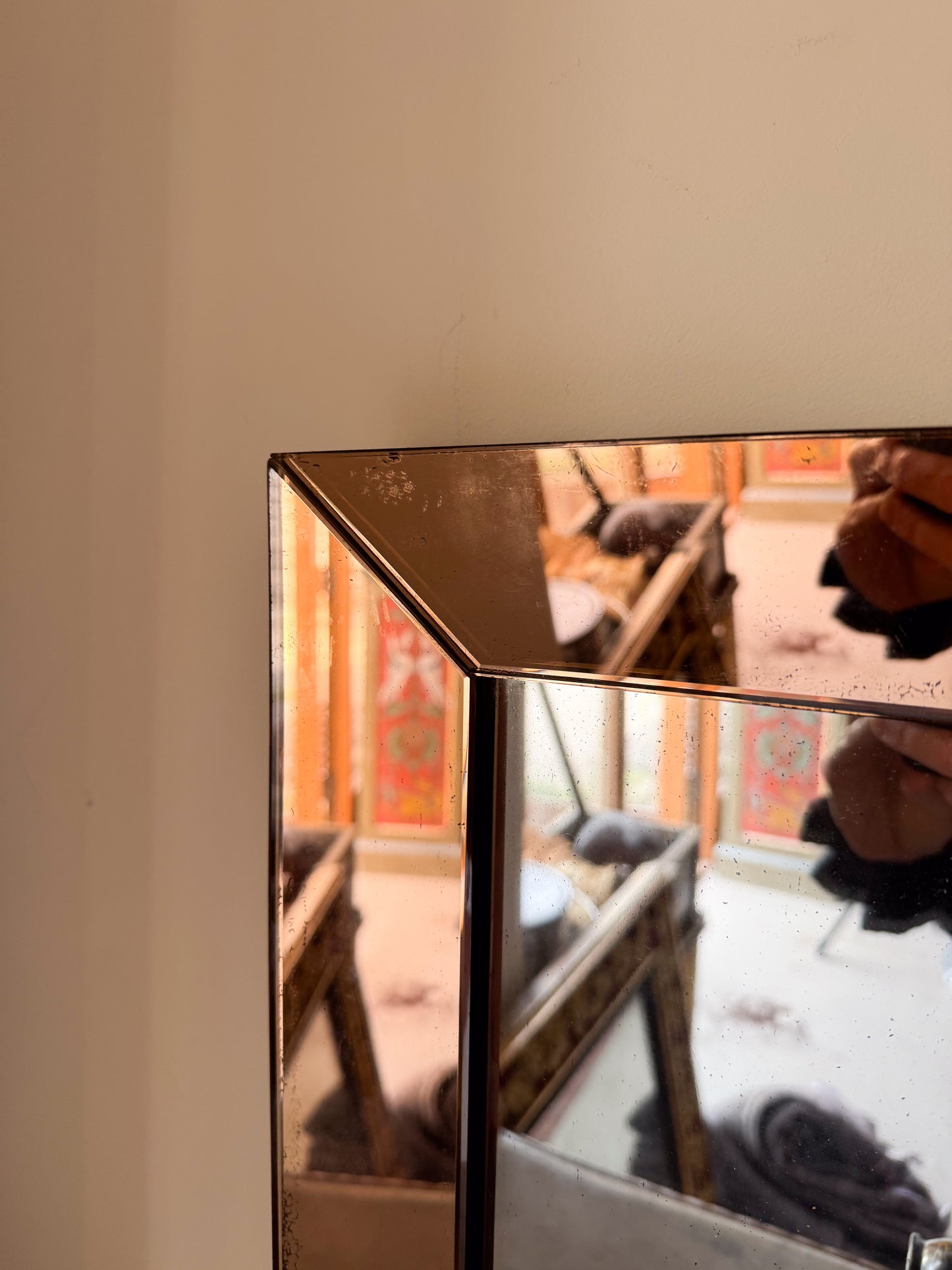 An Art Deco Peach Glass Mirror