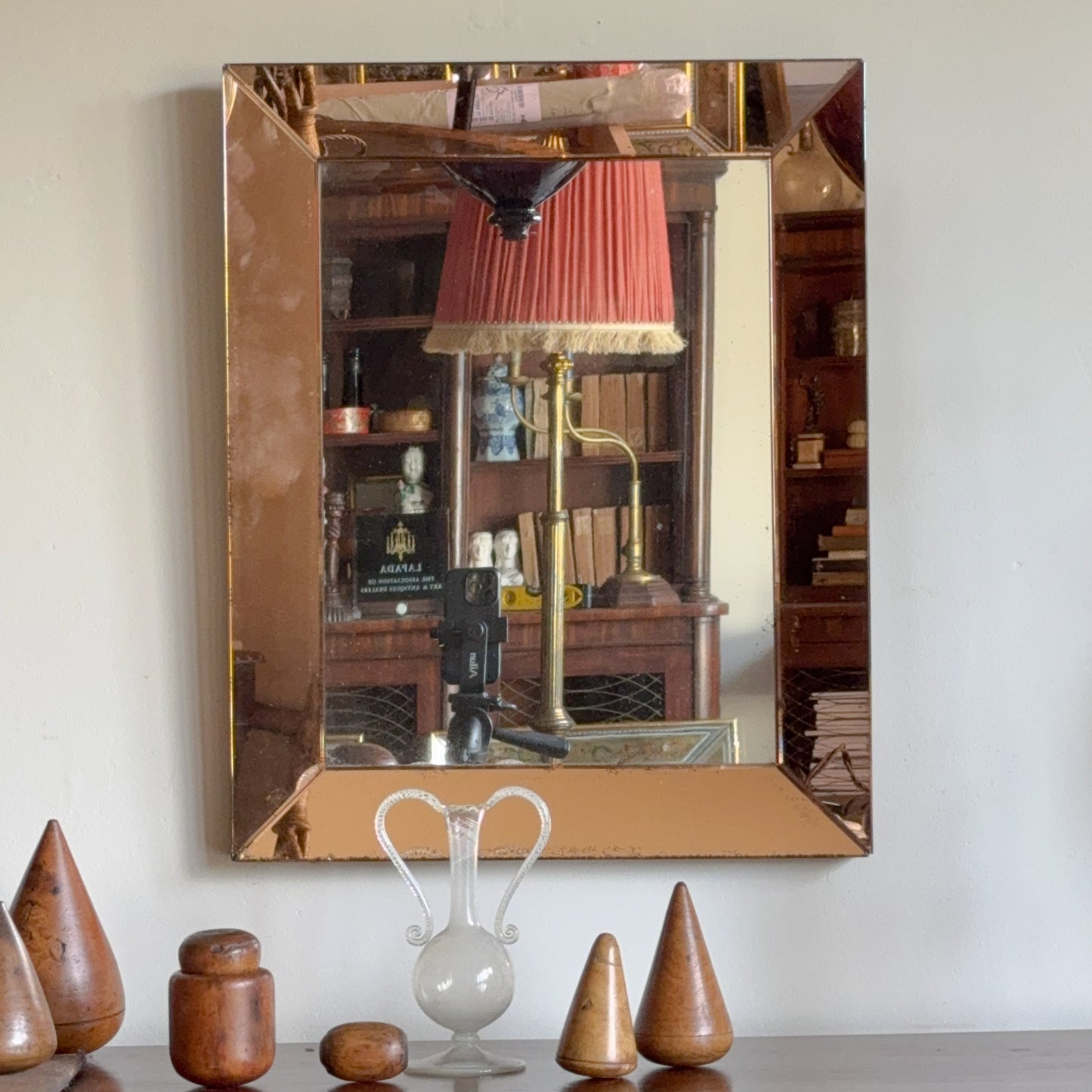 An Art Deco Peach Glass Mirror