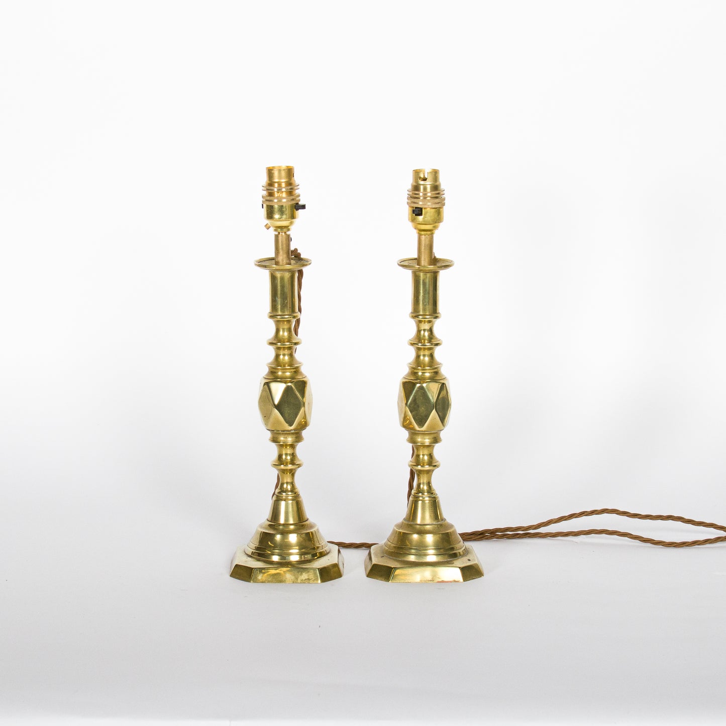 A pair of brass candlesticks converted to lamps - ’The Diamond Princess’