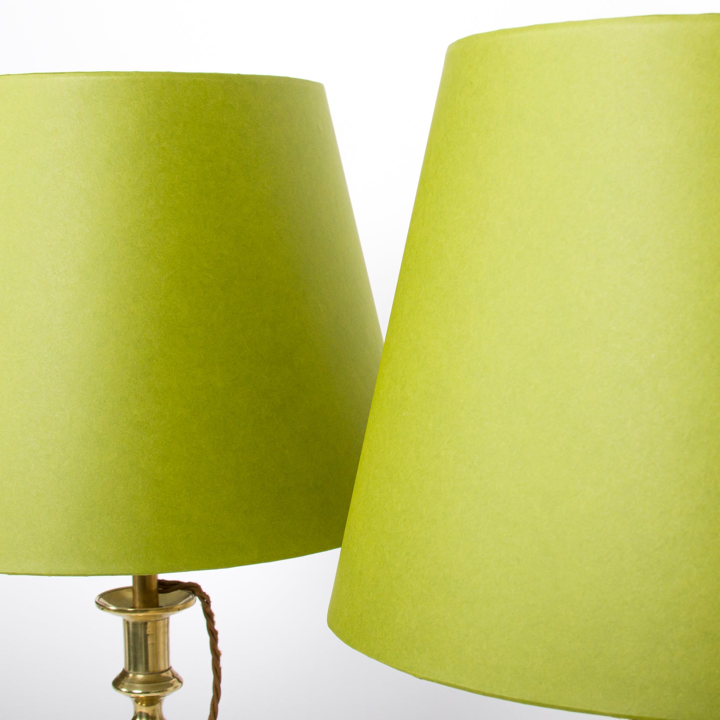 A pair of brass candlesticks converted to lamps, circa 1850