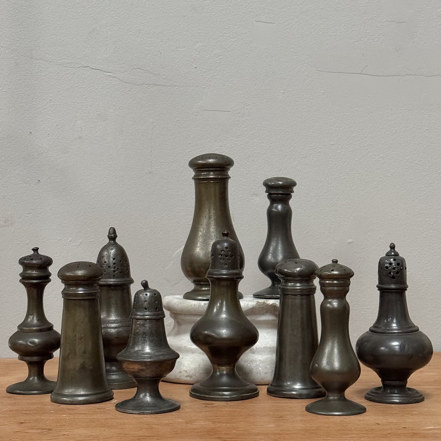 A Collection of Pewter Pepper Pots