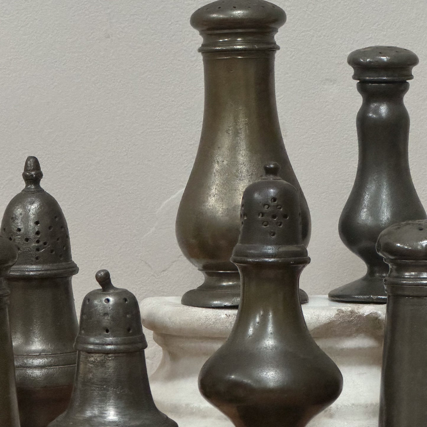 A Collection of Pewter Pepper Pots