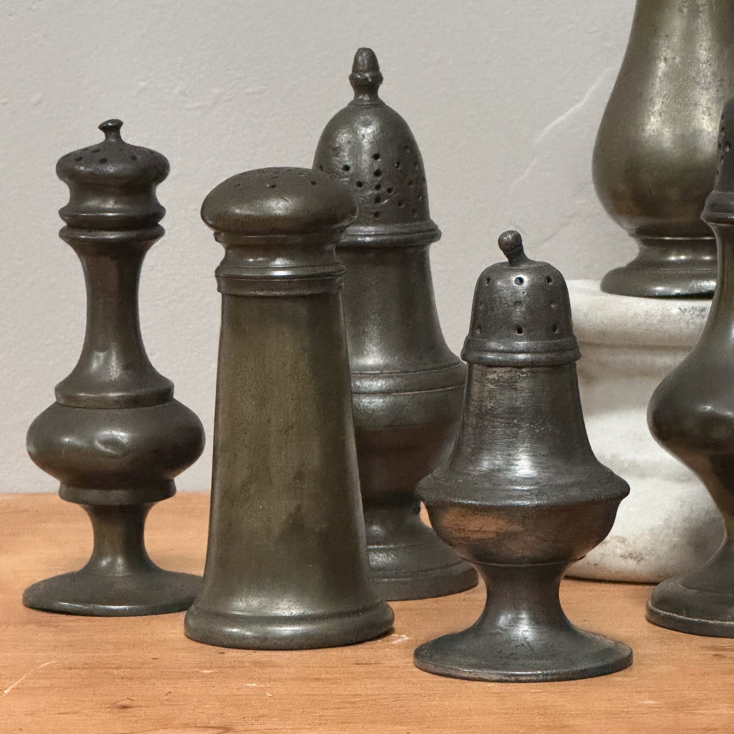 A Collection of Pewter Pepper Pots