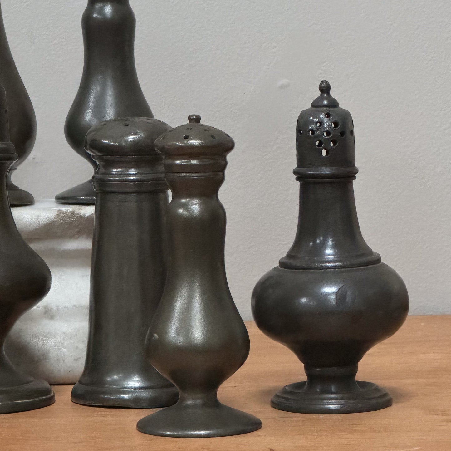 A Collection of Pewter Pepper Pots