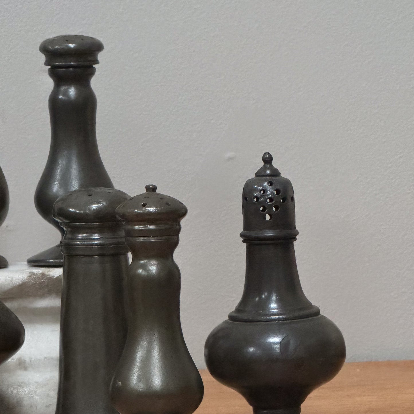 A Collection of Pewter Pepper Pots