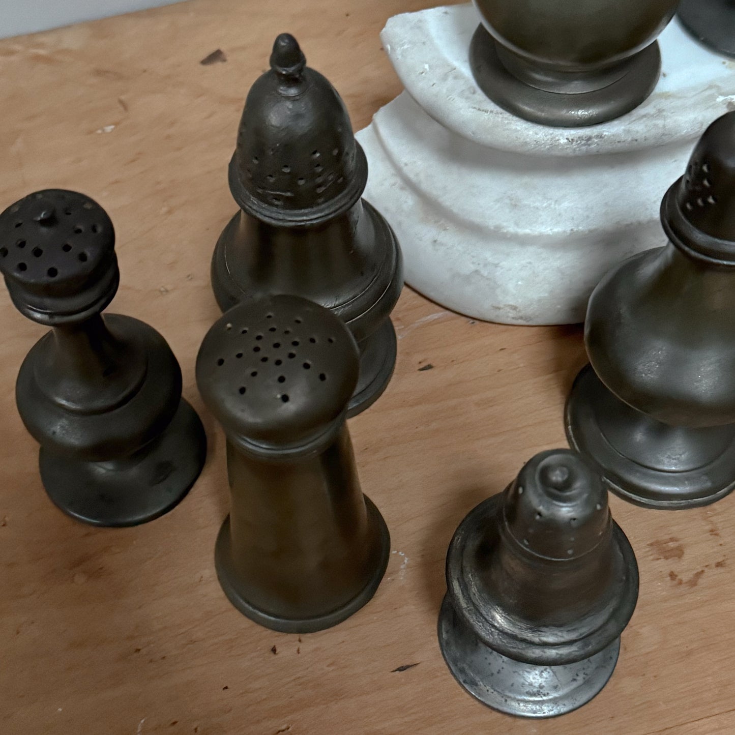 A Collection of Pewter Pepper Pots