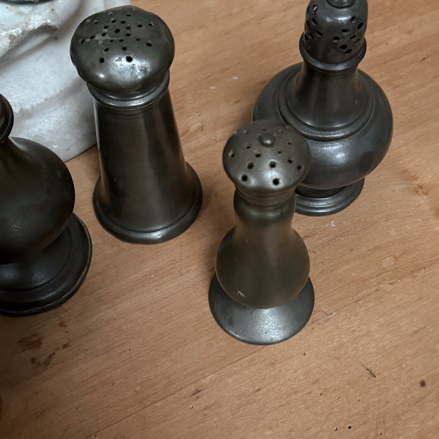 A Collection of Pewter Pepper Pots