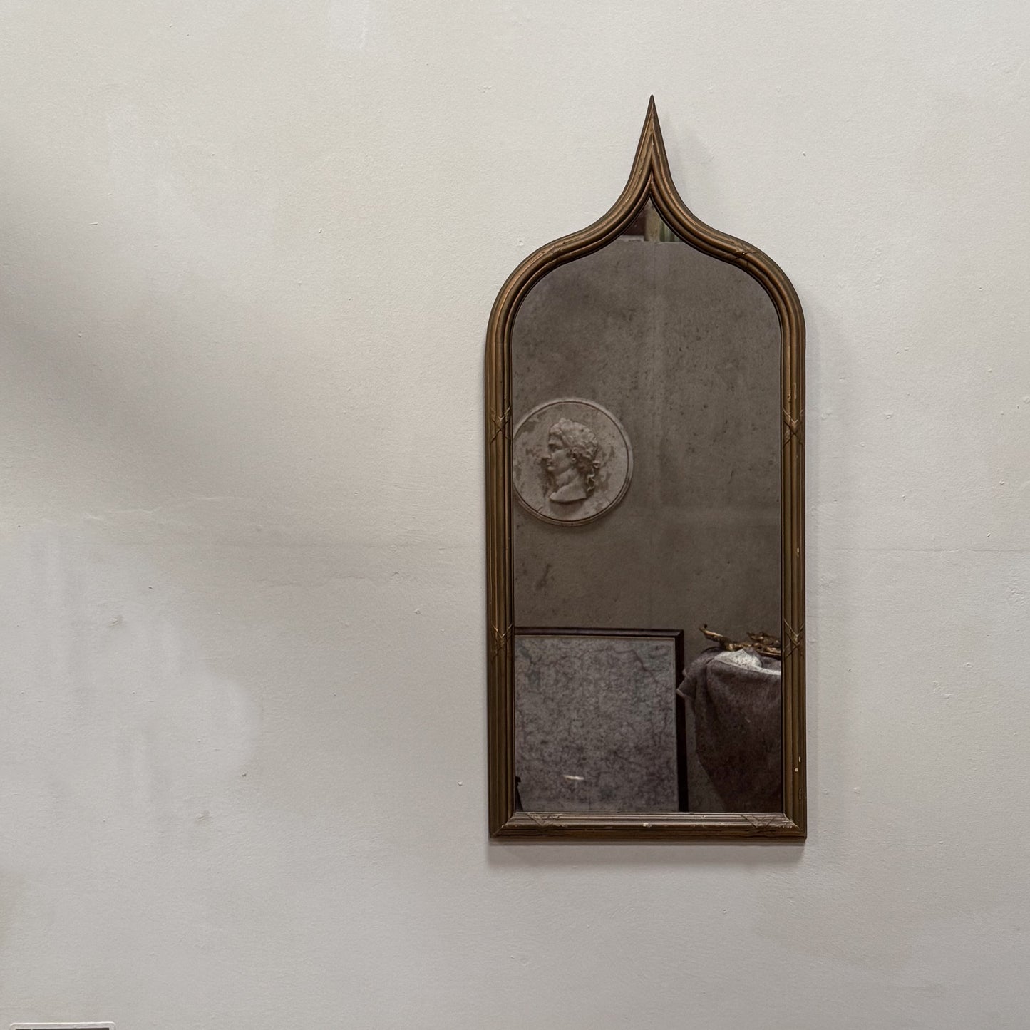 A Late 19th Century Gothic Gilt Mirror