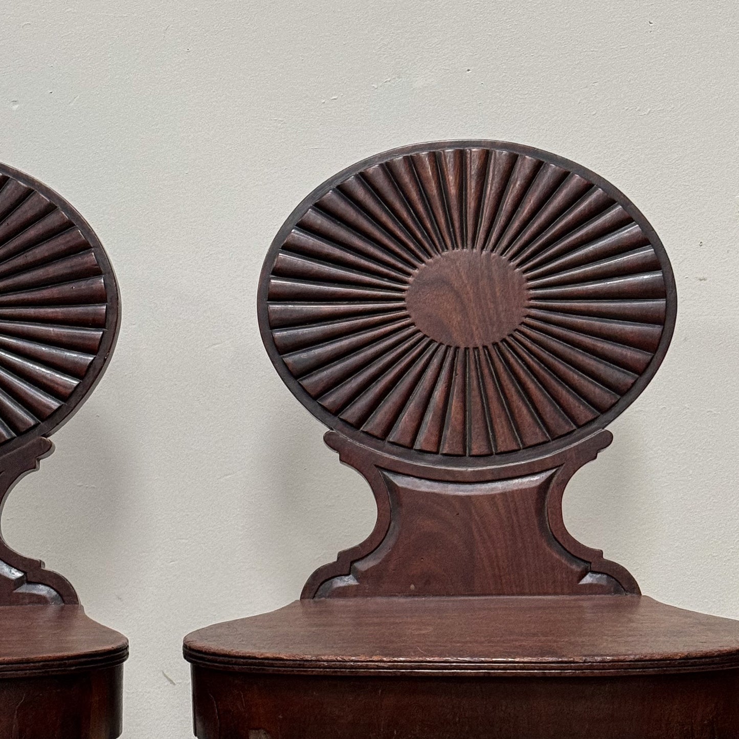 A Pair of George III Mahogany Hall Chairs