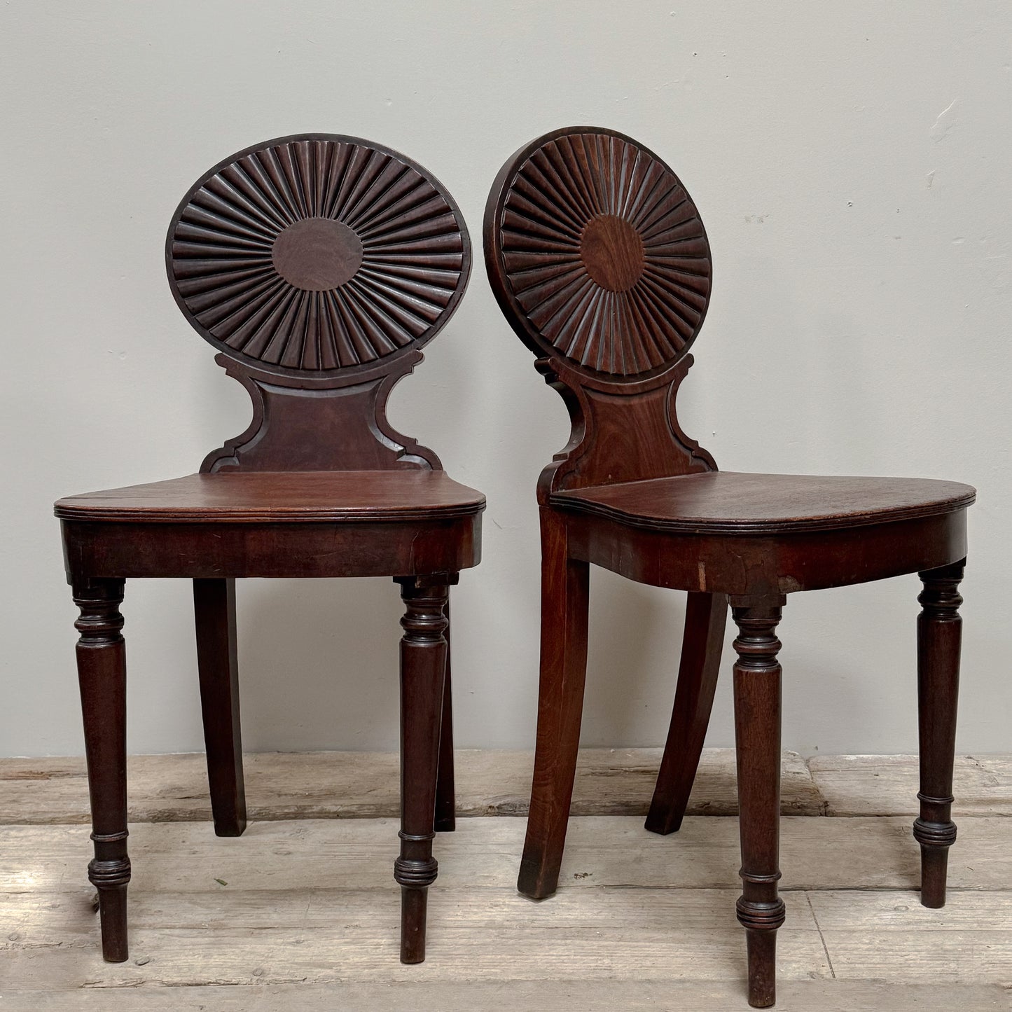 A Pair of George III Mahogany Hall Chairs