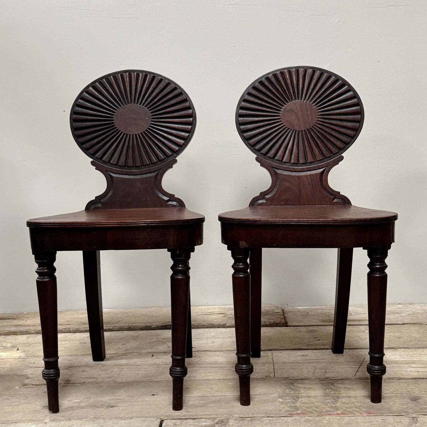 A Pair of George III Mahogany Hall Chairs