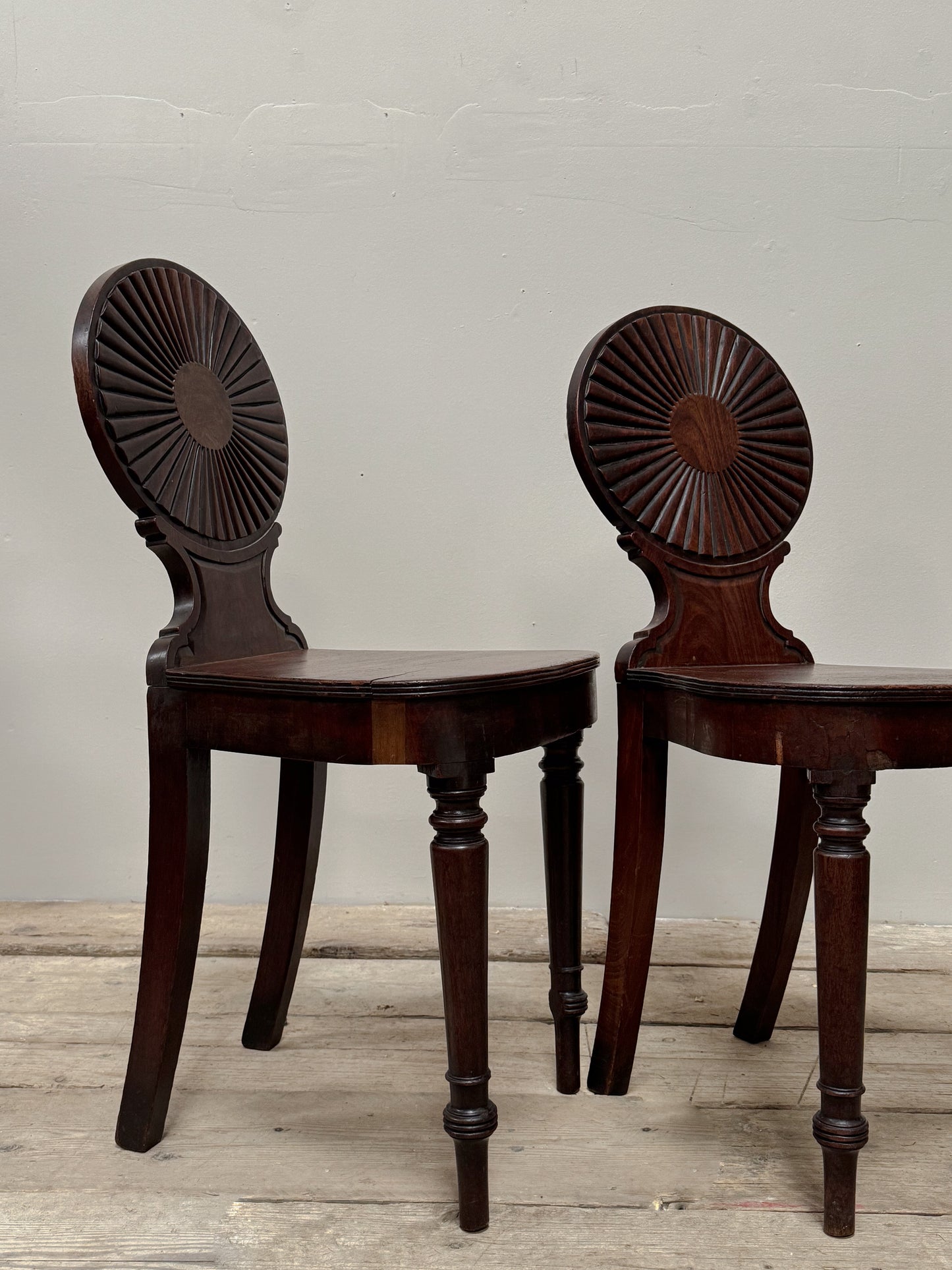 A Pair of George III Mahogany Hall Chairs