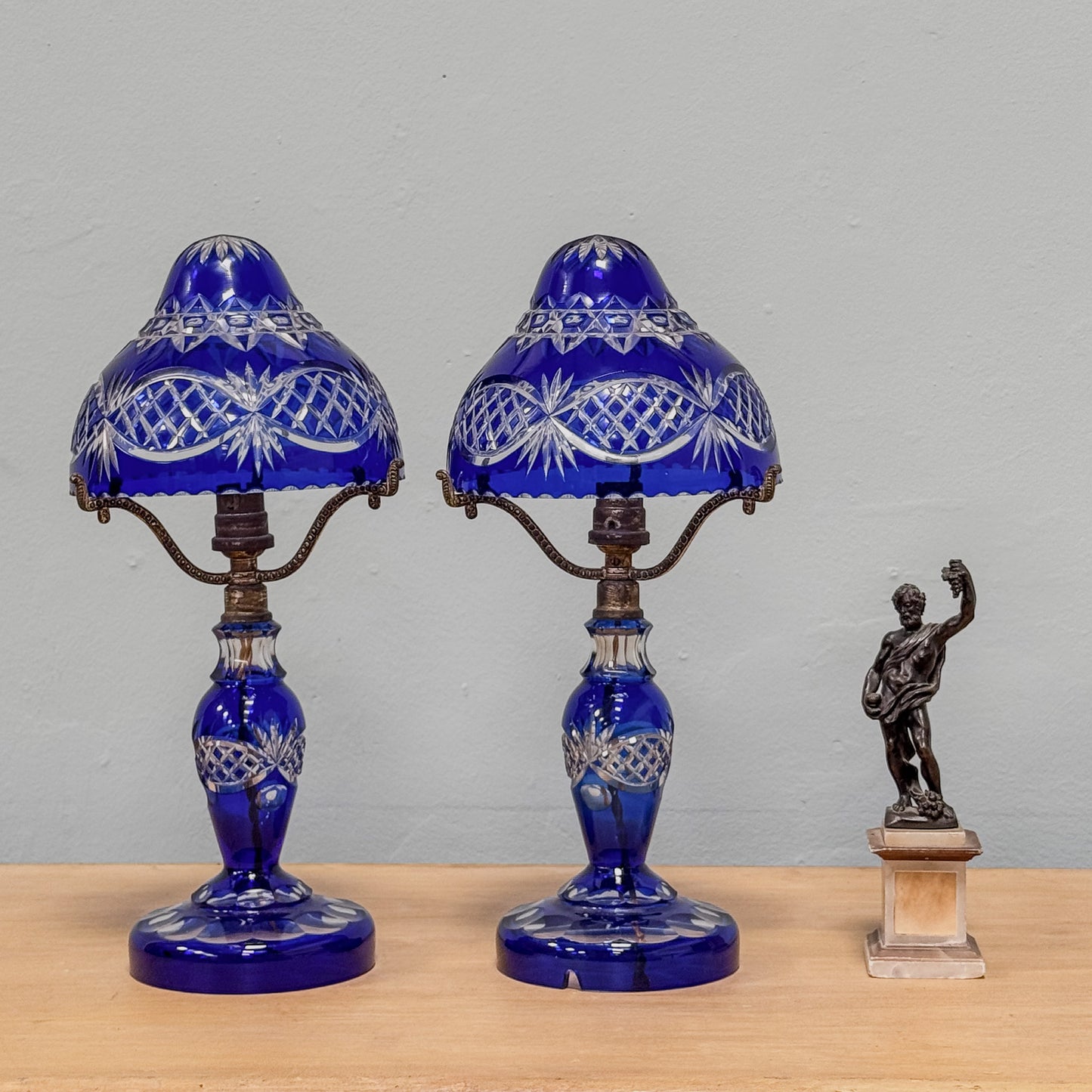 A Pair of Edwardian Bohemian Blue Cut Glass Lamps