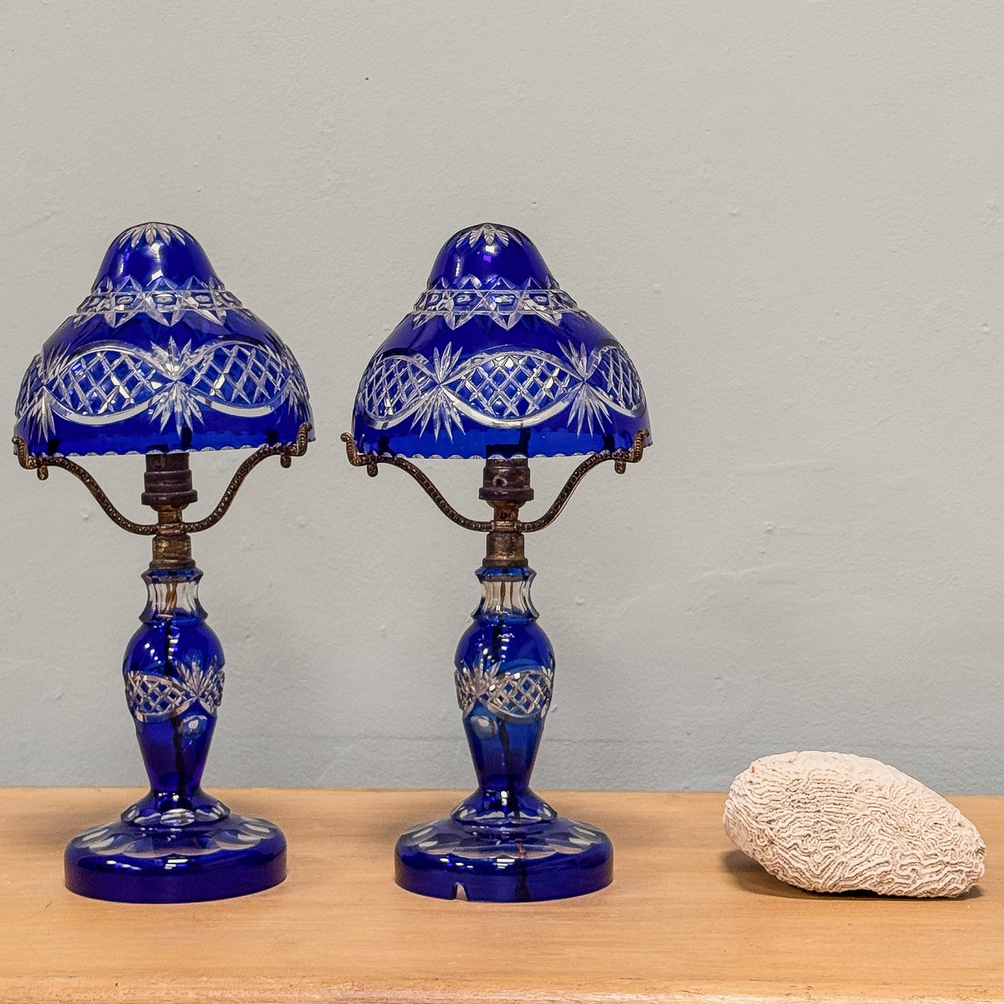 A Pair of Edwardian Bohemian Blue Cut Glass Lamps