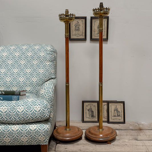A Pair of Early 20th Century Brass and Oak Standard Lamps