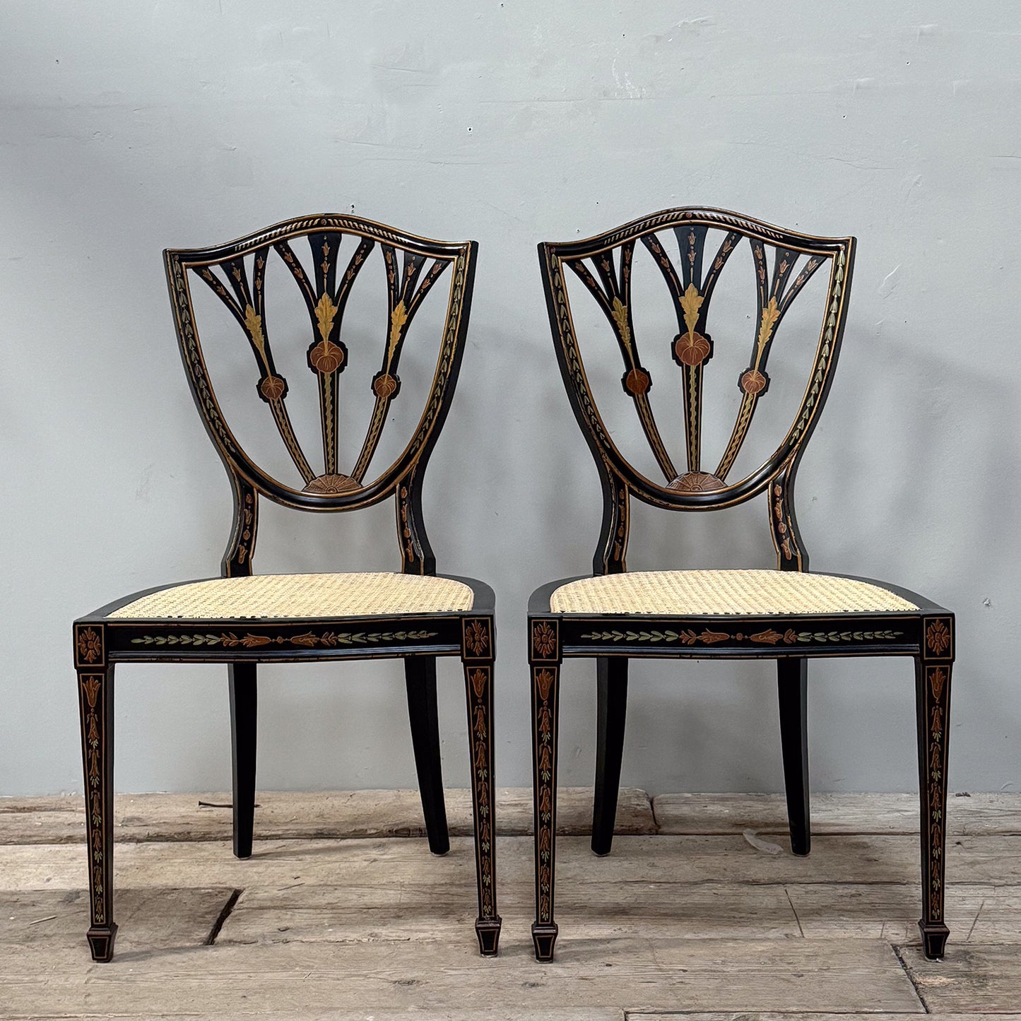 A Pair George III Style Ebonised and Polychrome Painted Open Armchairs