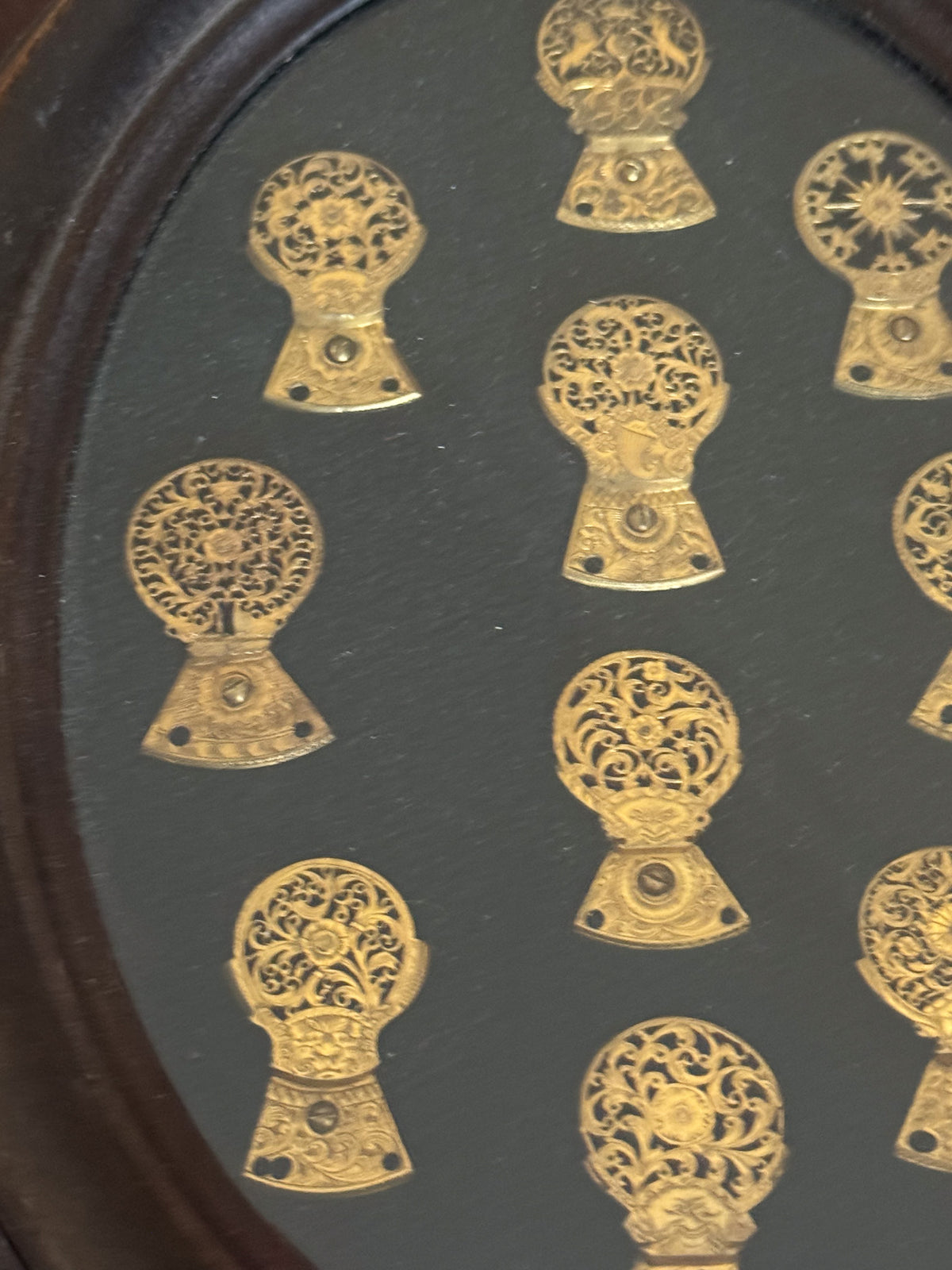 A Framed Collection of Antique Verge Watch Cocks