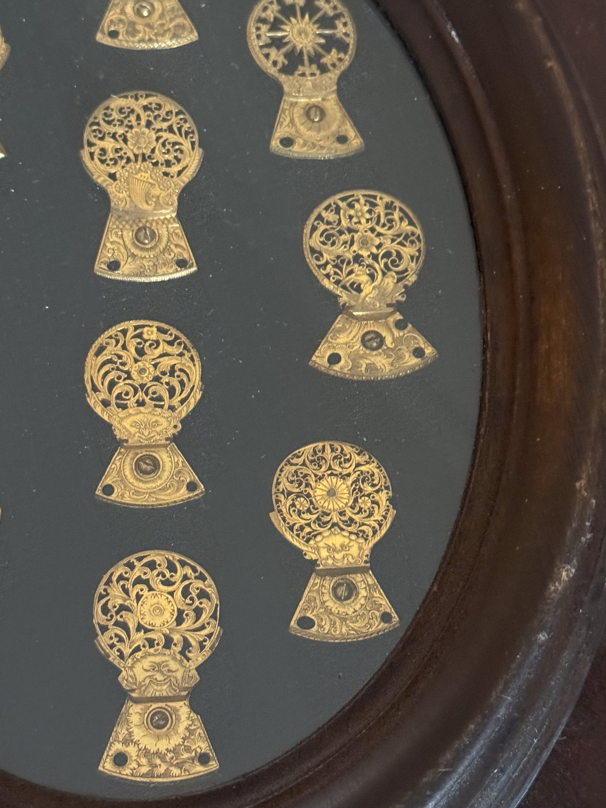 A Framed Collection of Antique Verge Watch Cocks