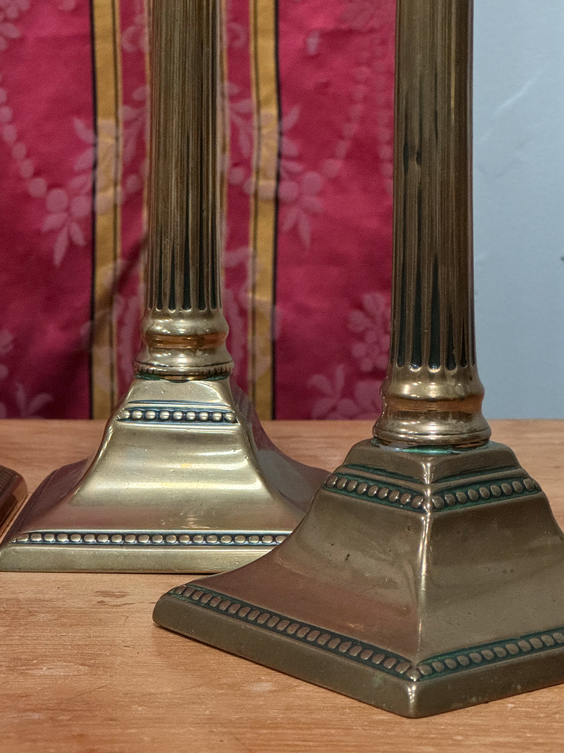 A Set of Four George III Brass Column Candlesticks