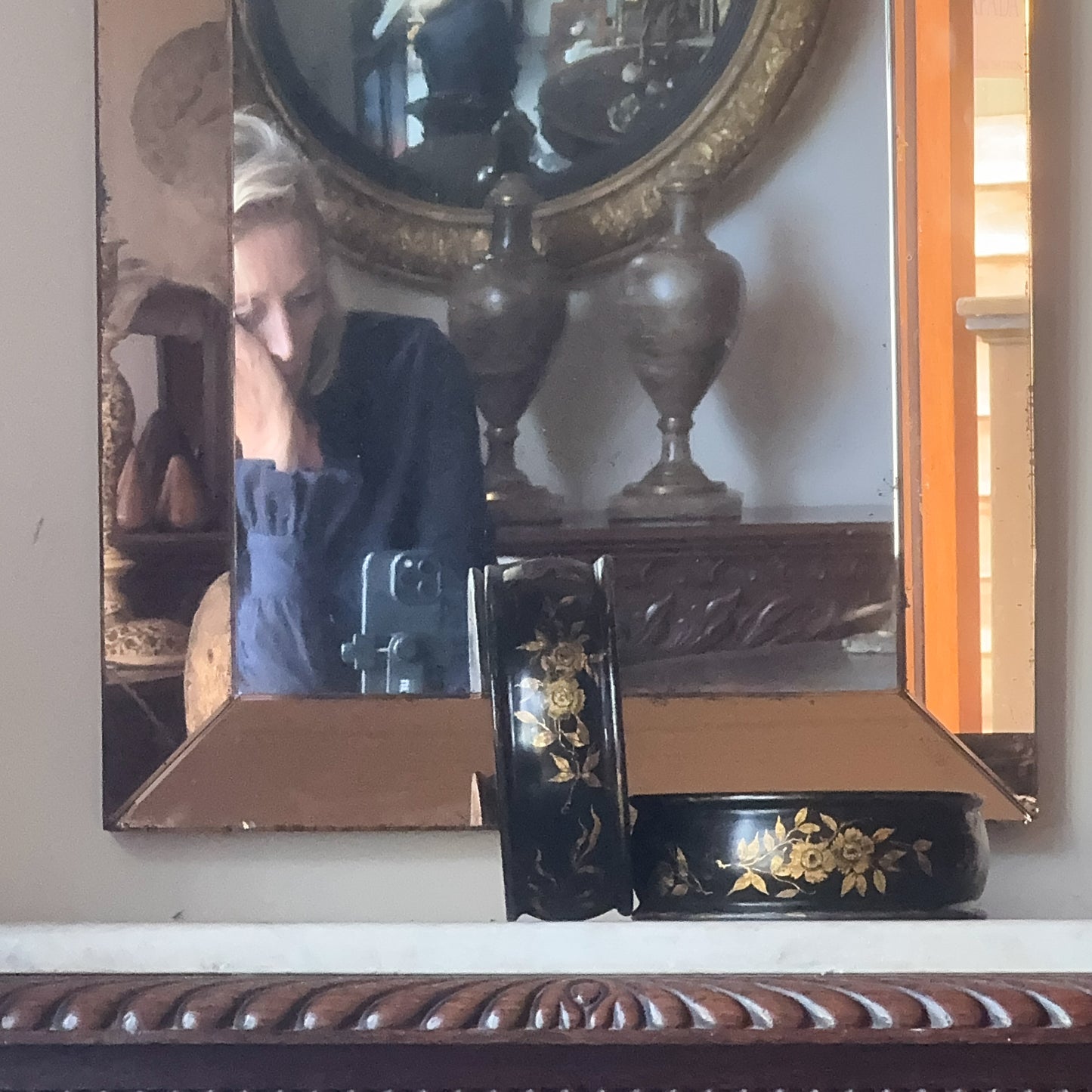 An Art Deco Peach Glass Mirror