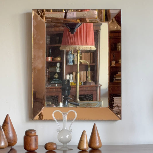 An Art Deco Peach Glass Mirror