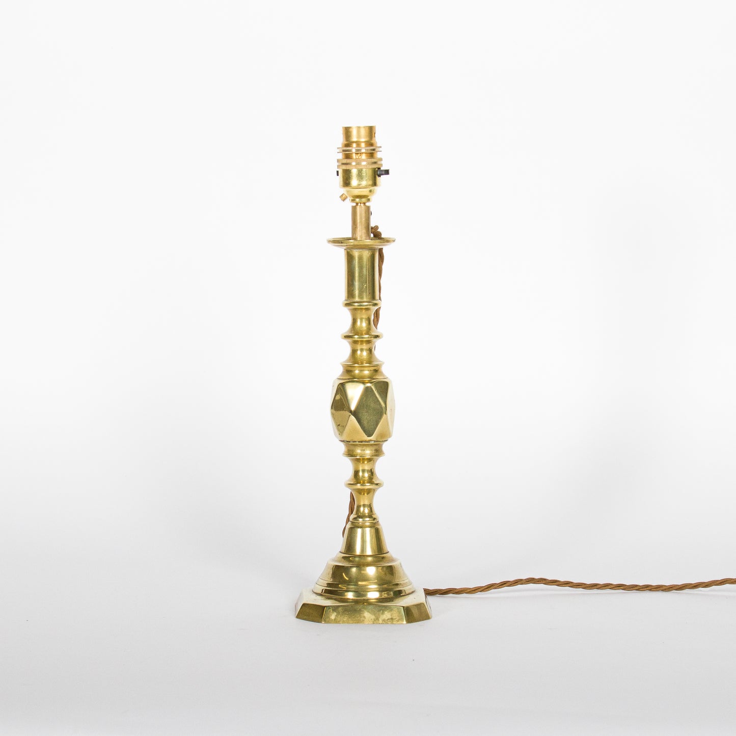 A pair of brass candlesticks converted to lamps - ’The Diamond Princess’